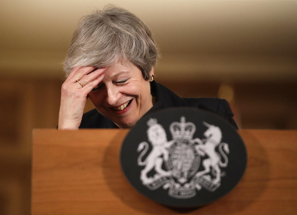 Britain's Prime Minister Theresa May reacts during a press conference inside 10 Downing Street in London, Thursday, Nov. 15, 2018. Two British Cabinet ministers, including Brexit Secretary Dominic Raab, resigned Thursday in opposition to the divorce deal struck by Prime Minister Theresa May with the EU — a major blow to her authority and her ability to get the deal through Parliament. (AP Photo/Matt Dunham, Pool)