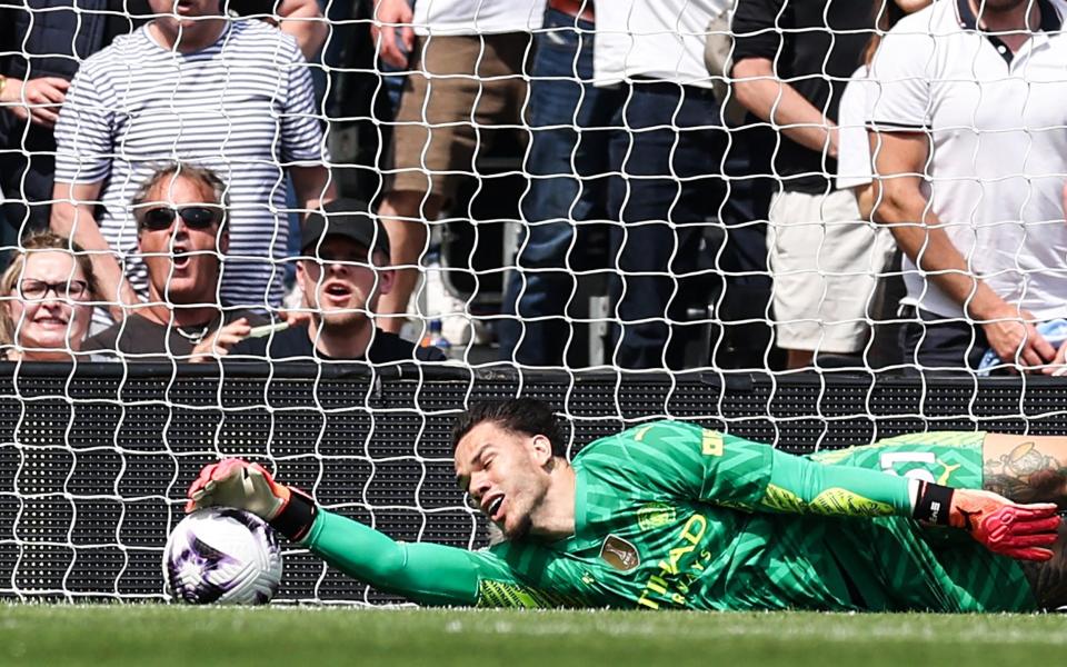 Ederson grabs hold of the ball