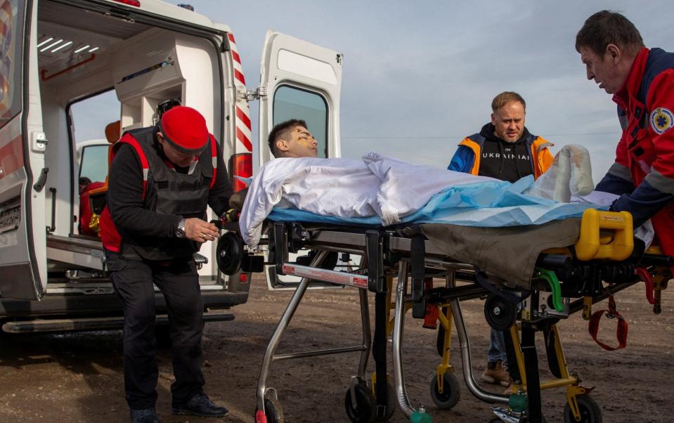 A 13-year-old boy is transported to Mykolaiv after he was wounded near Kherson - Reuters