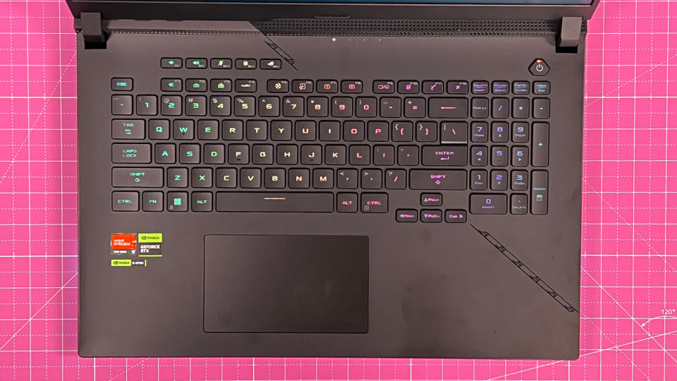 An Asus ROG Strix Scar 17 (2023) on a desk with a pink desk mat