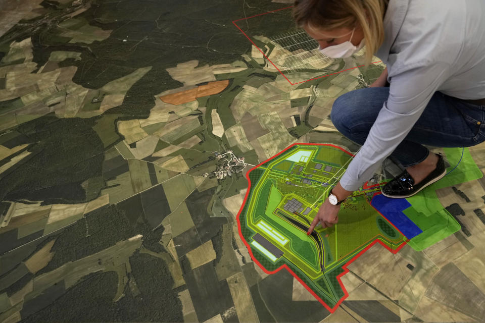 Audrey Guillemenet, geologist and spokesperson, shows a map of an underground laboratory run by French radioactive waste management agency Andra, in Bure, eastern France, Thursday, Oct. 28, 2021. Nuclear power is a central sticking point as negotiators plot out the world’s future energy strategy at the climate talks in Glasgow, Scotland. (AP Photo/Francois Mori)