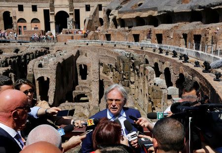 Diego Della Valle (C), President and CEO of Tod's, speaks to journalists ahead of a news conference about the latest stage of restoration of the Colosseum by luxury goods firm Tod's in Rome, Italy, July 1, 2016. REUTERS/Alessandro Bianchi