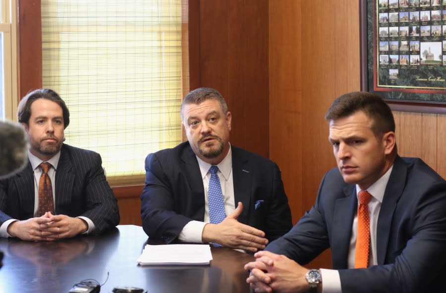 Christopher Rogers, left, and Corey Shipley, right, listen as co-counsel Eric Hertz discusses the civil lawsuit they’ve filed related to the 2023 officer-involved shooting death of Casey Crowley in Sullivan County, Tenn. (Photo: WJHL)