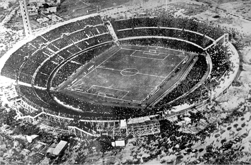 FILE - Aerial view of the Centenario stadium in Montevideo, Uruguay, July 30, 1930. A unique 2030 World Cup is set to be played in Europe and Africa with the surprising addition of South America. A key lure of the unprecedented three-continent project will open in the Uruguayan capital of Montevideo, where the Centenario Stadium hosted the inaugural 1930 World Cup final.(AP Photo, file)