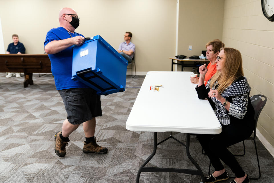 Election workers perform a recount of ballots from the recent primary election at the Montour County administration center in Danville, Pa., Friday, May 27, 2022. (AP Photo/Matt Rourke)