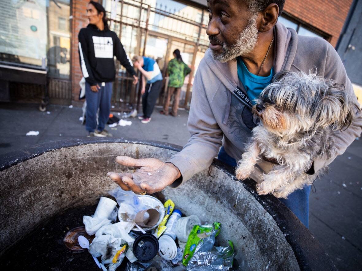 Hugh Lampkin holds heroin in the Downtown Eastside neighbourhood in Vancouver, B.C. on Wednesday, Sept. 21.  (Ben Nelms/CBC - image credit)