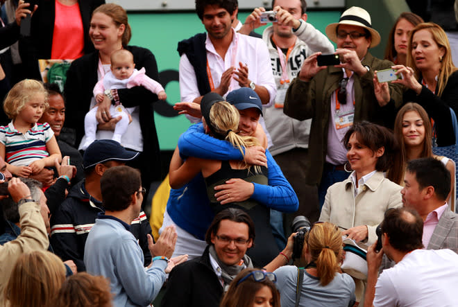 PARIS, FRANCE - JUNE 09: Maria Sharapova of Russia hugs her coach Thomas Hogstedt as she celebrates victory eith her team in the box after the women's singles final against Sara Errani of Italy during day 14 of the French Open at Roland Garros on June 9, 2012 in Paris, France. (Photo by Clive Brunskill/Getty Images)