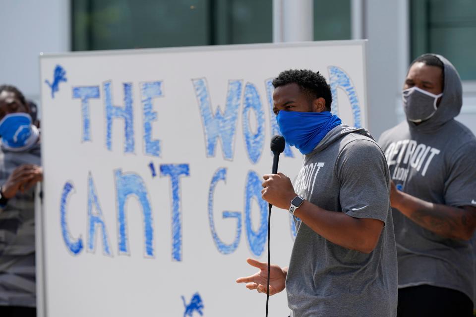 Detroit Lions defensive end Trey Flowers addresses the media with his teammates outside the Lions NFL football camp practice facility, Tuesday, Aug. 25, 2020, in Allen Park, Mich. The players were reacting to the recent shooting of Jacob Blake in Kenosha, Wis., two days earlier.