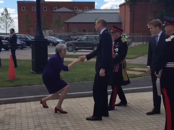 Theresa May greets Prince William with awkwardly low curtsy during visit to new rehab centre
