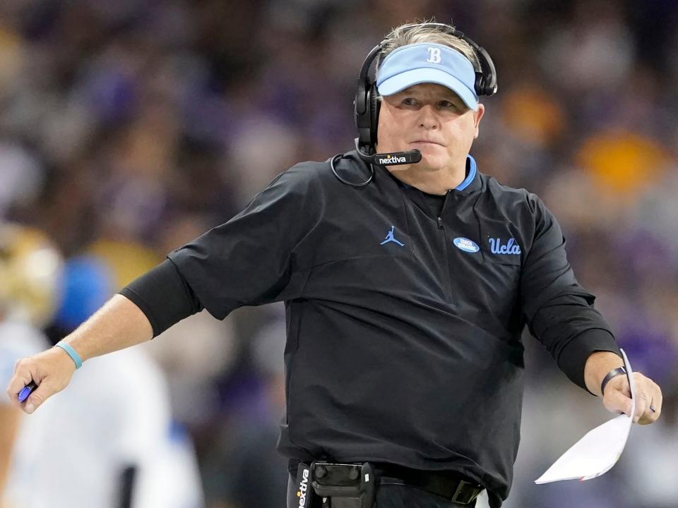 FILE - UCLA head coach Chip Kelly looks on during the second half of an NCAA college football game against Washington, Oct. 16, 2021, in Seattle. Kelly agreed to a new four-year contract with UCLA on Friday, Jan. 14, 2022, after he led the Bruins to their best season since 2015. The agreement also came two days before the $9 million buyout on Kellyâ€™s original contract would have expired. (AP Photo/Ted S. Warren, File)