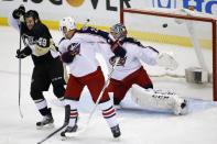 Pittsburgh Penguins' Brian Gibbons (49) deflects a shot over Columbus Blue Jackets goalie Sergei Bobrovsky (72) for a goal in the first period of a first-round NHL playoff hockey game in Pittsburgh on Saturday, April 19, 2014. (AP Photo/Gene J. Puskar)