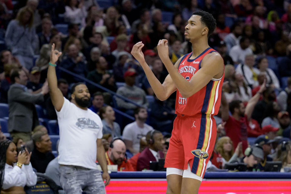 New Orleans Pelicans guard Trey Murphy III (25) celebrates a basket with fans during the second half of an NBA basketball game against the Washington Wizards in New Orleans, Wednesday, Feb. 14, 2024. (AP Photo/Matthew Hinton)
