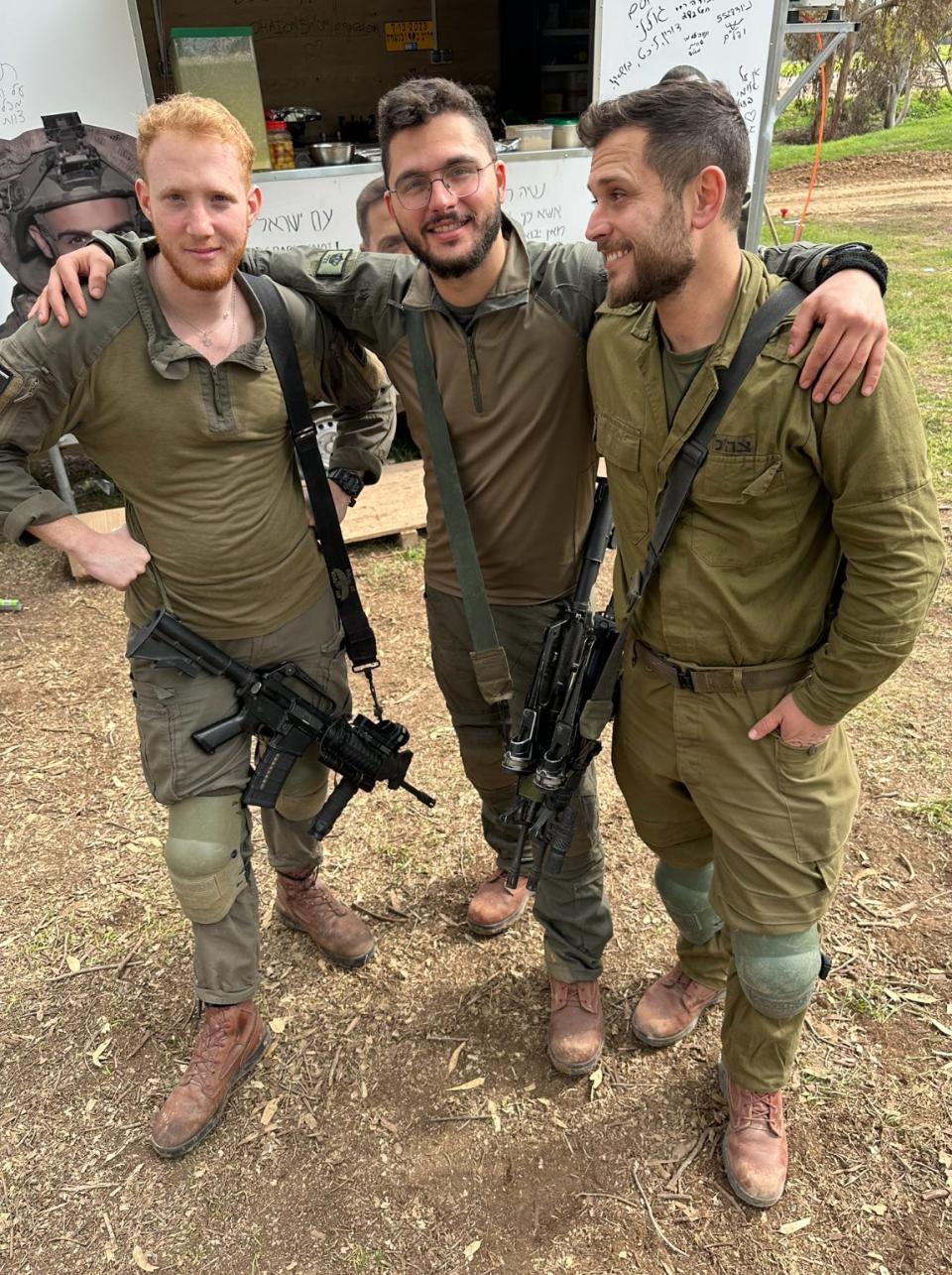 Israeli soldiers Ofek Kirpi, Yonatan Sela Havazelet and Charlie Lanin on brief leave from nearby Gaza. “This,” says Charlie, “is where I’m supposed to be."