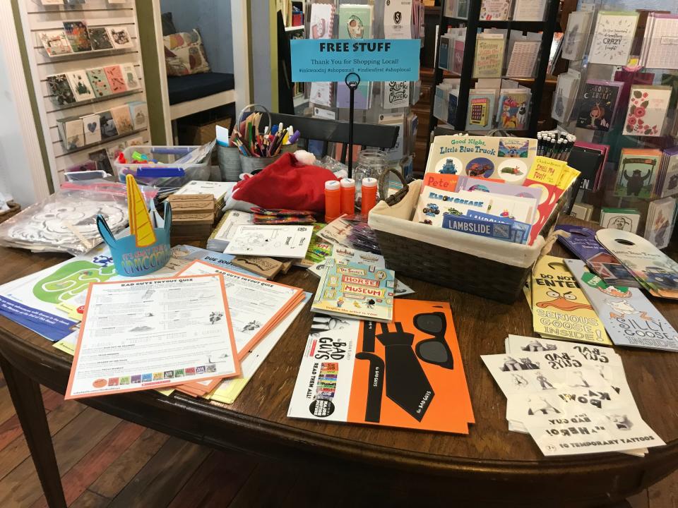 A table inside Inkwood Books in Haddonfield offers free takeaways for kids, including activity pages, stickers, temporary tattoos and craft kits.