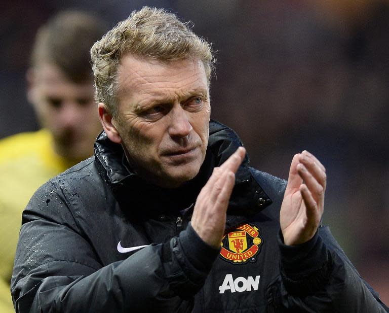 File picture taken on February 1, 2014 shows Manchester United's then manager David Moyes applauding the fans after his side's English Premier League match against Stoke City in Stoke-on-Trent