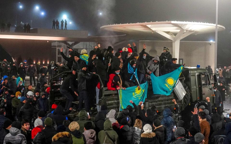 Protesters take part in a rally over a hike in energy prices in Almaty on January 5 - AFP