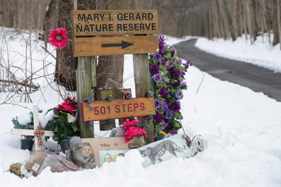 Tokens sit in the snow at a memorial for Abby Williams and Libby German along the Monon High Bridge Trail, Wednesday, Feb. 9, 2022 in Delphi. Abby Williams and Libby German, both Delphi eighth-graders, were murdered while hiking a popular community trail near Delphi on Feb. 13, 2017.