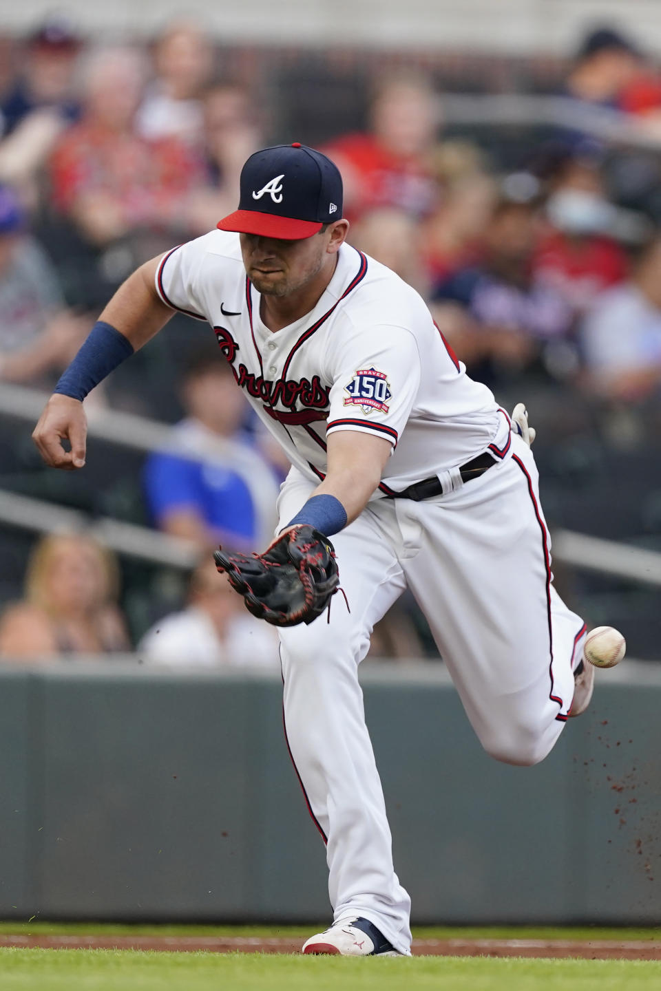 Atlanta Braves third baseman Austin Riley can't reach a ball hit for a single by Washington Nationals' Trea Turner in the first inning of a baseball game Tuesday, June 1, 2021, in Atlanta. (AP Photo/John Bazemore)