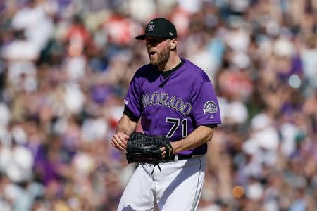 May 5, 2019; Denver, CO, USA; Colorado Rockies relief pitcher Wade Davis (71) reacts after the game against the Arizona Diamondbacks at Coors Field. Mandatory Credit: Isaiah J. Downing-USA TODAY Sports