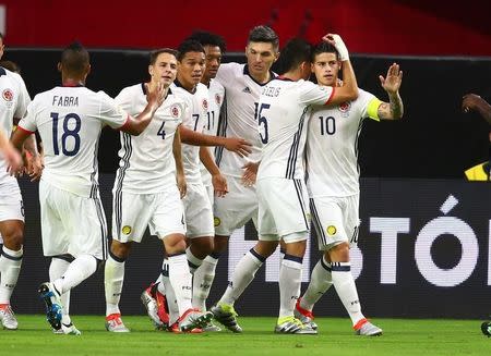 Jun 25, 2016; Glendale, AZ, USA; Colombia midfielder James Rodriguez (10) celebrates with midfielder Guillermo Celis (5) after a first half goal by forward Carlos Bacca (7) against the United States during the third place match of the 2016 Copa America Centenario soccer tournament at University of Phoenix Stadium. Mark J. Rebilas-USA TODAY Sports