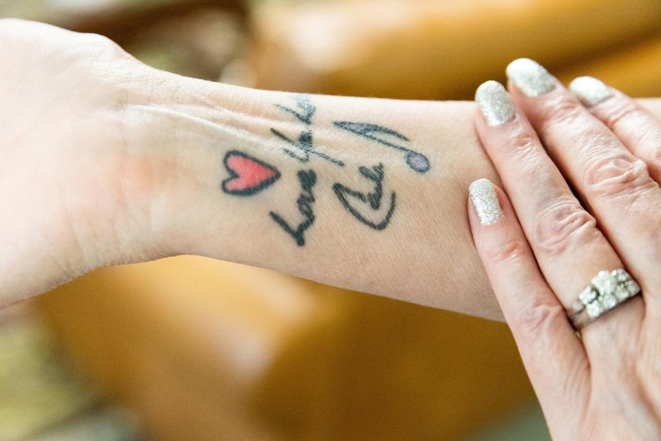 Charla Haley shows the tattoo she got of her twin’s handwriting after she passed away, at the Presidential Club Condos in Salt Lake City on Saturday, July 8, 2023. After losing her own twin, Haley has built a friendship with “Twinful Twin” Tasha Cram. | Megan Nielsen, Deseret News