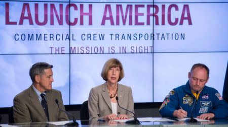 Kathy Lueders, program manager of NASA's Commercial Crew Program, speaks along with former astronaut Bob Cabana, director of NASA's Kennedy Space Center and Astronaut Mike Fincke, a former commander of the International Space Station (L-R) during a news conference at NASA's Kennedy Space Center in Cape Canaveral, Florida, September 16, 2014. REUTERS/NASA/Bill Ingalls