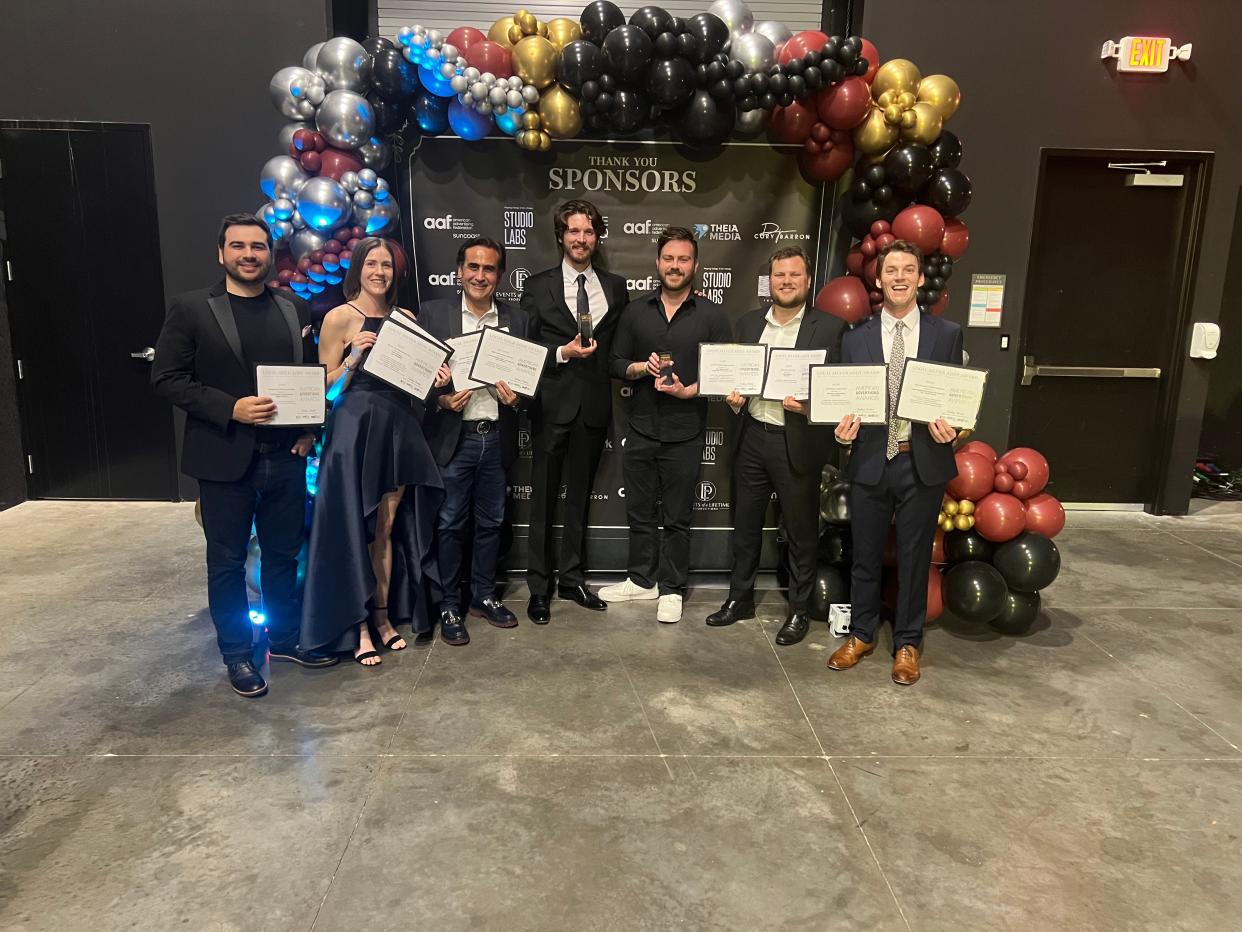 The Next-Mark team celebrates the agency’s many victories at the ADDYs. They are JT Grano, left, Ashley Bernhardt, President Joseph Grano, Luke Piety, Ryan Hoevenaar, Travis Cornwell and Sawyer Lang.