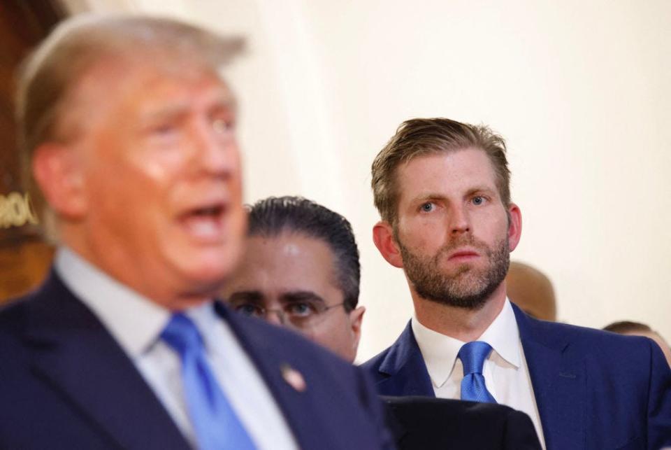 Eric Trump looks at Donald Trump