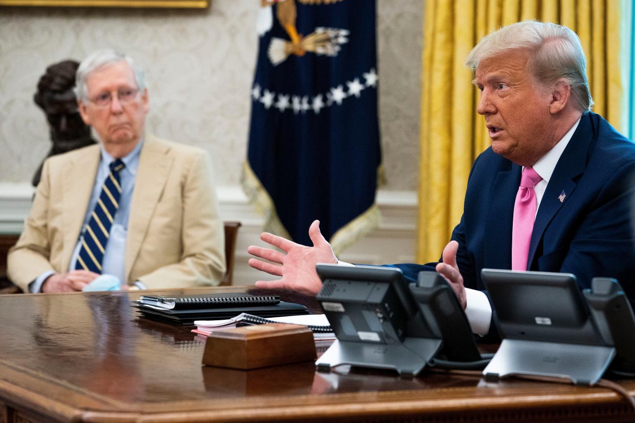 <p>Senate Majority Leader Mitch McConnell (R-KY) (L) listens to U.S. President Donald Trump talks to reporters while hosting Republican congressional leaders and members of Trump's cabinet in the Oval Office at the White House July 20, 2020 in Washington, DC.</p> (Photo by Doug Mills-Pool/Getty Images)