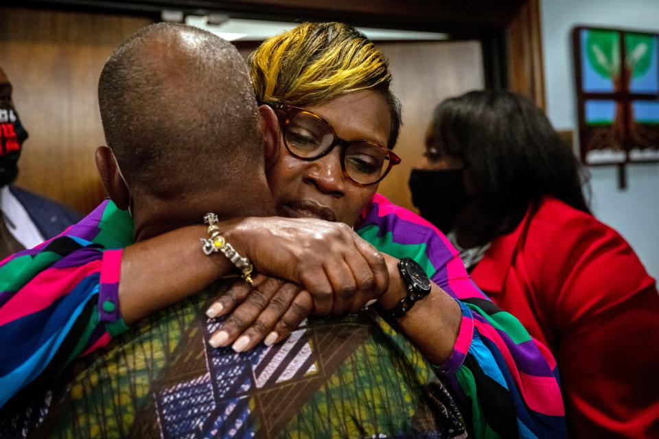 Ahmaud Arbery's mother, Wanda Cooper-Jones, is hugged by a supporter on Wednesday after the jury convicted the three men charged with her son's murder in February 2020.