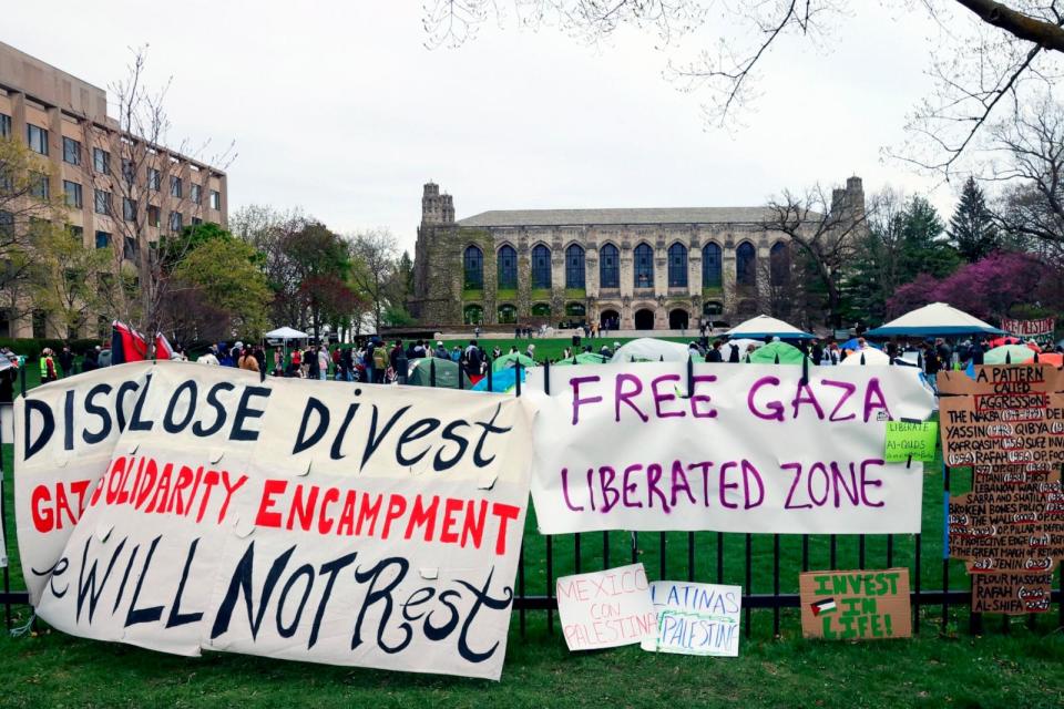 PHOTO: Signs are displayed outside a tent encampment at Northwestern University, April 26, 2024, in Evanston, Ill. (Teresa Crawford/AP)