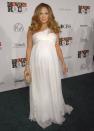 <p>Just three months before her twins are born, Lopez attends a concert in LA in an angelic cream chiffon gown.</p>