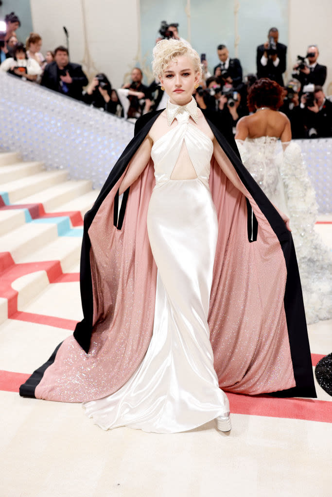 Julia Garner attends The 2023 Met Gala in a white gown