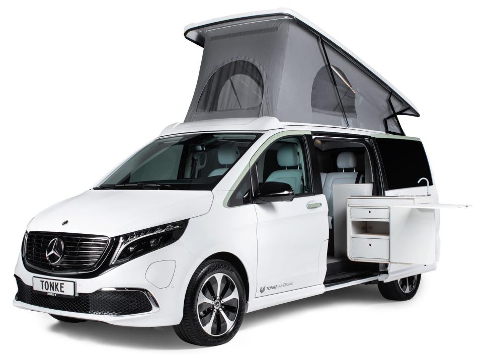 A rendering of the Tonke's Touring EQV camper van with a kitchen extending out the side of the van.