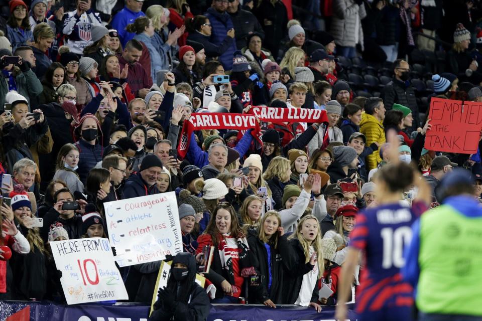 U.S. forward Carli Lloyd waves to fans after a friendly against South Korea.