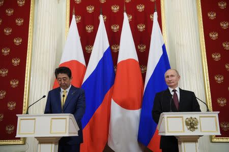 Russian President Vladimir Putin (R) and Japanese Prime Minister Shinzo Abe make a joint statement following their meeting at the Kremlin in Moscow, Russia January 22, 2019. Sputnik/Alexei Druzhinin/Kremlin via REUTERS