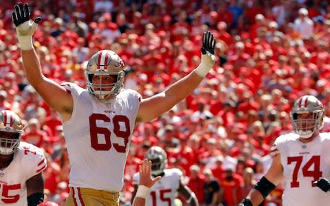 San Francisco 49ers offensive tackle Mike McGlinchey (69) celebrates as running back Alfred Morris (46) scores a touchdown during the first half of an NFL football game against the Kansas City Chiefs in Kansas City - Credit: (AP Photo/Charlie Riedel)