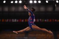 <p>USA's Simone Biles competes in the artistic gymnastics balance beam event of the women's qualification during the Tokyo 2020 Olympic Games at the Ariake Gymnastics Centre in Tokyo on July 25, 2021. (Photo by Loic VENANCE / AFP) (Photo by LOIC VENANCE/AFP via Getty Images)</p> 