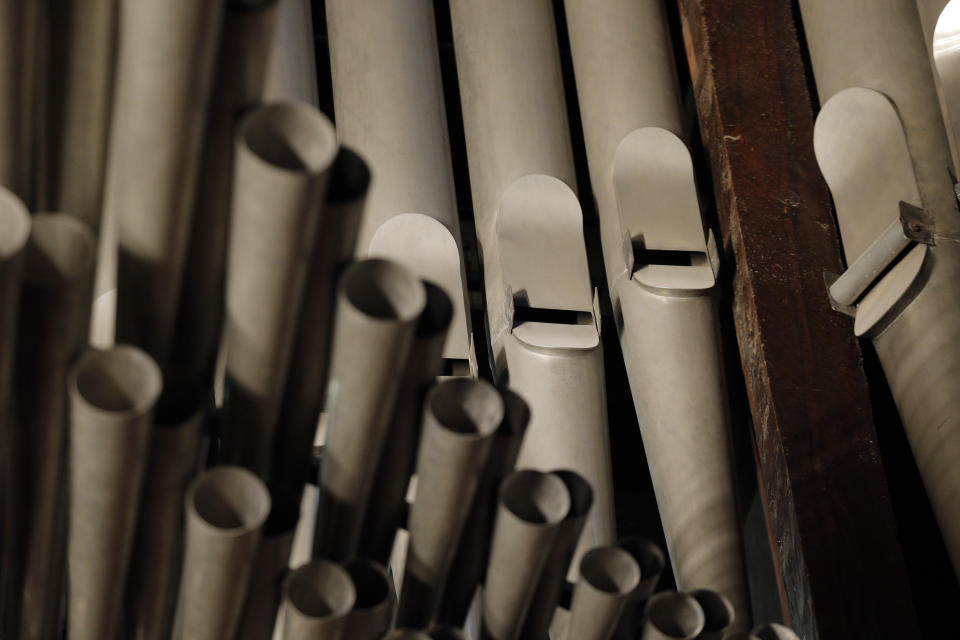 FILE - This This May 2, 2013 file photo shows organ pipes at Notre Dame cathedral in Paris. Pipe by precious pipe, the organ that once thundered through fire-ravaged Notre Dame Cathedral is being taken apart. The mammoth task of dismantling, cleaning and re-assembling France's largest musical instrument started Monday Aug.3, 2020 and is expected to last nearly four years. (AP Photo/Christophe Ena, File)