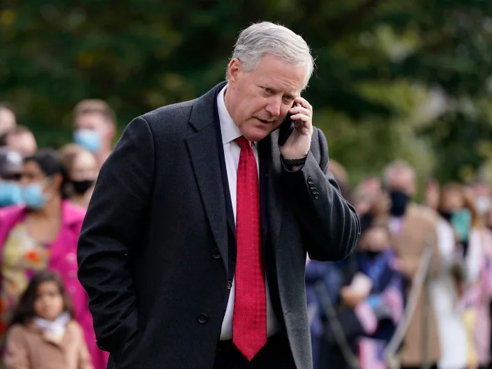 White House chief of staff Mark Meadows speaks on a phone on the South Lawn of the White House in Washington, Friday, Oct. 30, 2020, before President Donald Trump's departure on Marine One.