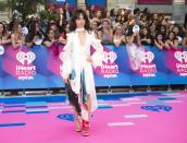 <p>The former Fifth Harmony member chose a white dress with watercolour-esque accents. </p>