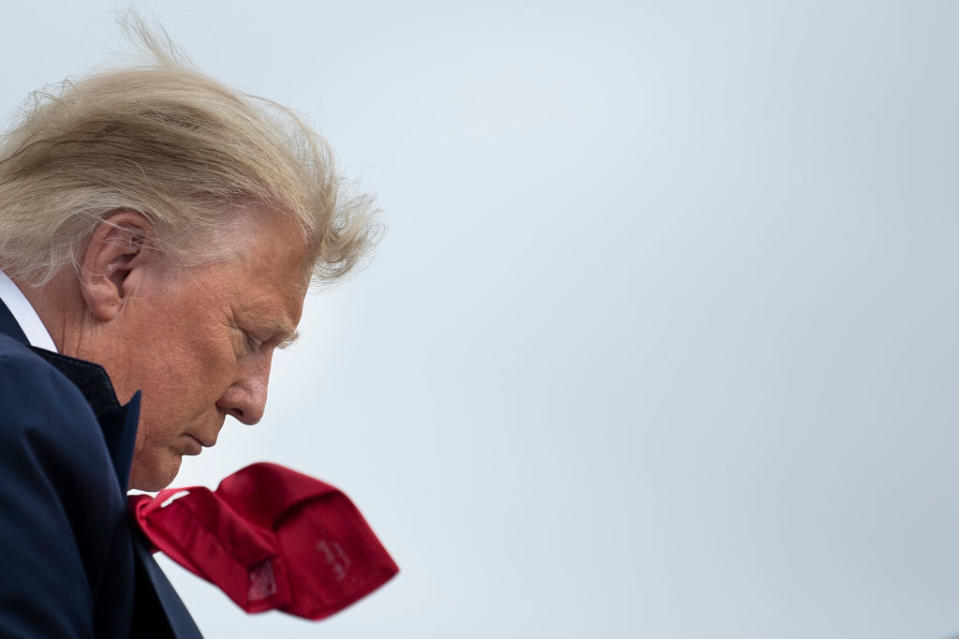 US President Donald Trump boards Air Force One at Miami International Airport in Miami, Florida en route to campaign events on November 2, 2020. - The US presidential campaign enters its final day Monday with a last-minute scramble for votes by Donald Trump and Joe Biden, drawing to a close an extraordinary race that has put a pandemic-stricken country on edge