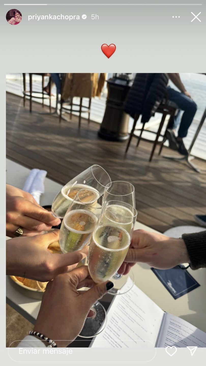 a group of people holding glasses of liquid