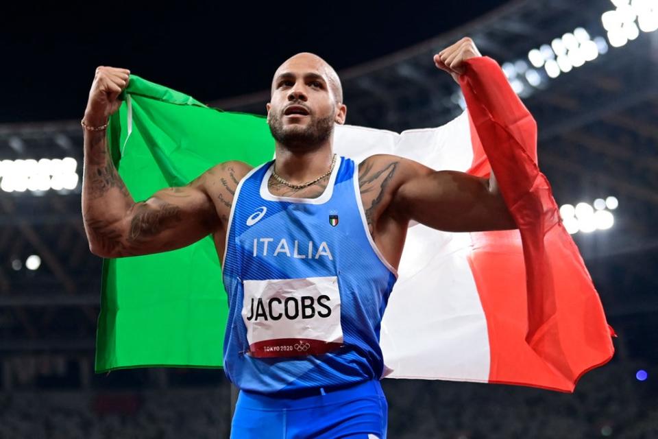 Jacobs celebrates becoming Olympic 100m champion (Getty)