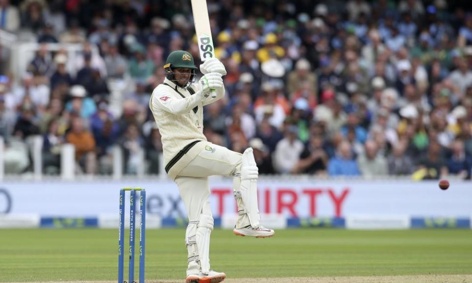 Usman Khawaja hits a shot against England