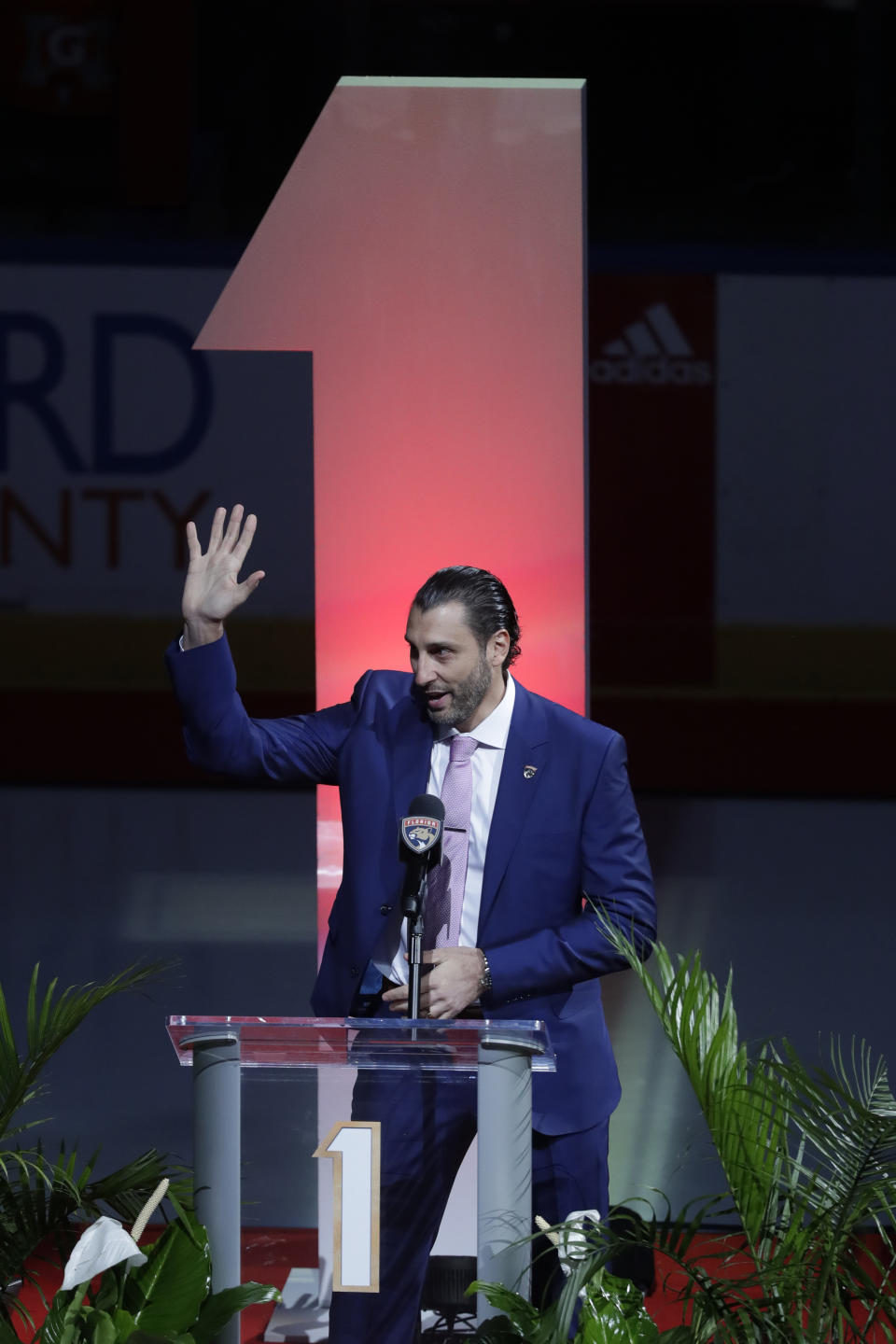 Former Florida Panthers goalie Roberto Luongo waves to fans as he is introduced before his jersey is hoisted to the rafters during a ceremony before an NHL hockey game against the Montreal Canadiens, Saturday, March 7, 2020, in Sunrise, Fla. (AP Photo/Wilfredo Lee)