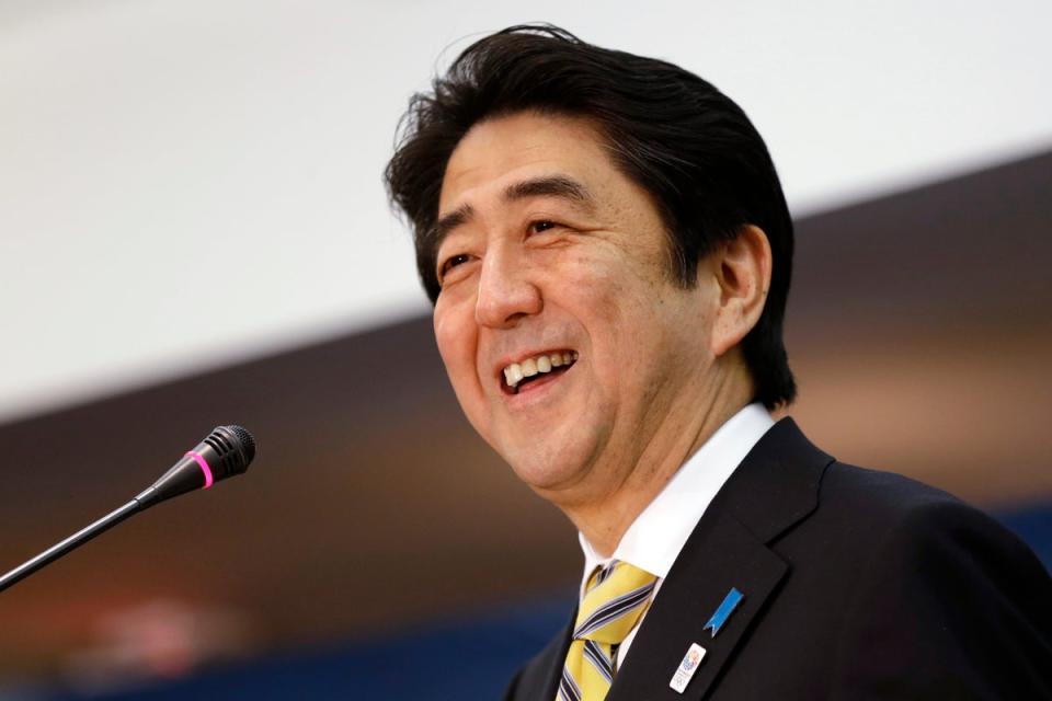 File  Then-Japanese prime minister Shinzo Abe laughs while speaking at the Center for Strategic International Studies in Washington in 2013 (AP)
