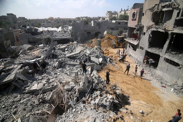 <p>Abed Rahim Khatib/Anadolu via Getty</p> Destroyed buildings in Gaza following airstrikes on Oct. 12, 2023