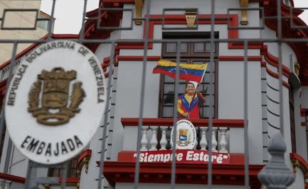 An image of Venezuela's late President Hugo Chavez with a sign that reads: 'I will always be there' is seen at the entry of the Venezuela's embassy in Lima, Peru, August 11, 2017 REUTERS/Mariana Bazo