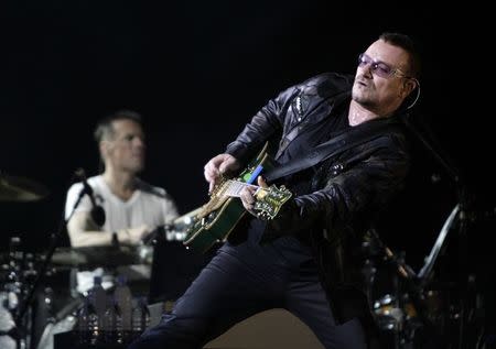 Lead singer Bono of the rock band U2 performs during the opening night of the North American leg of their 360 degree tour at Soldier Field in Chicago, in this file photo taken September 12, 2009. Bono, who was injured in a cycling accident last year, said on January 2, 2015, his recovery has not been easy and he may never play guitar again. REUTERS/Jeff Haynes/Files